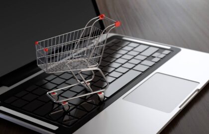Laptop with shopping cart Singapore e-commerce platform
